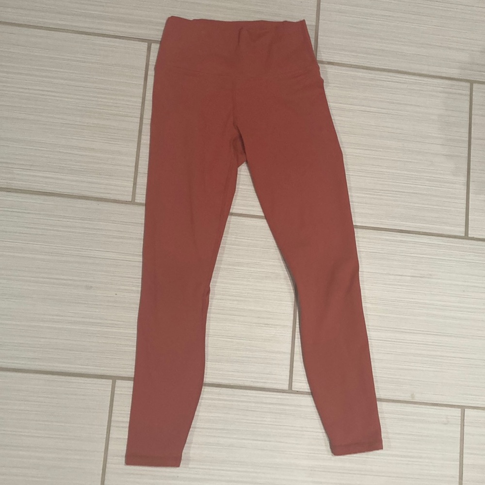 XXS auburn leggings, with cross knit phone holder on back.